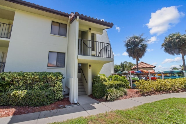 view of property featuring stairs