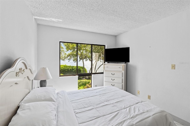 bedroom featuring a textured ceiling