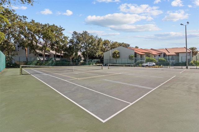 view of sport court with fence