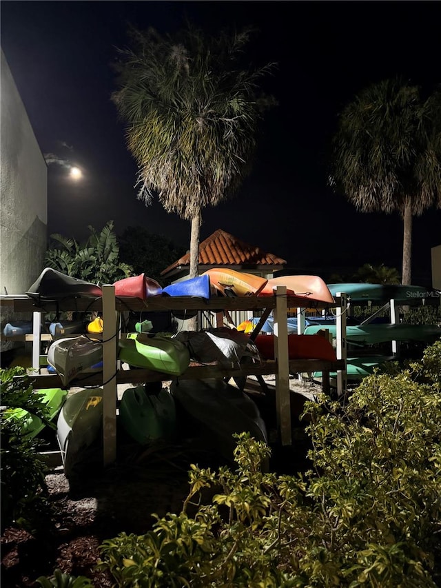 yard at twilight featuring a boat dock