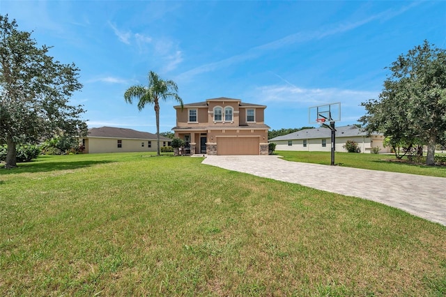 116 Caladium Ct, Bradenton, FL 34212 - view of front of property with an attached garage, decorative driveway, a front yard, stucco siding, and stone siding