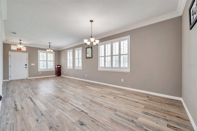 116 Caladium Ct, Bradenton, FL 34212 - empty room with a chandelier, light wood-style floors, baseboards, and ornamental molding