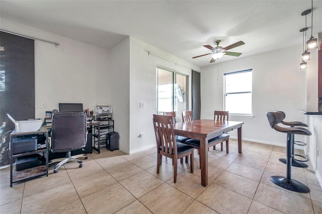 116 Caladium Ct, Bradenton, FL 34212 - dining space featuring a ceiling fan, a desk, light tile patterned floors, and baseboards