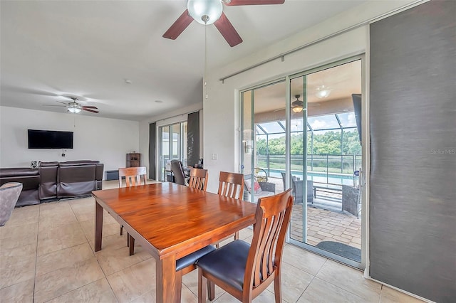 dining space featuring ceiling fan and light tile patterned floors