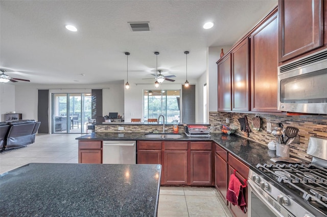 116 Caladium Ct, Bradenton, FL 34212 - kitchen with stainless steel appliances, ceiling fan, a sink, tasteful backsplash, and recessed lighting