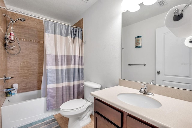 full bathroom featuring vanity, shower / bath combination with curtain, a textured ceiling, toilet, and tile patterned floors