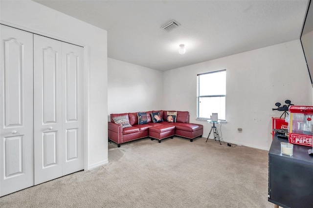 living room featuring light carpet