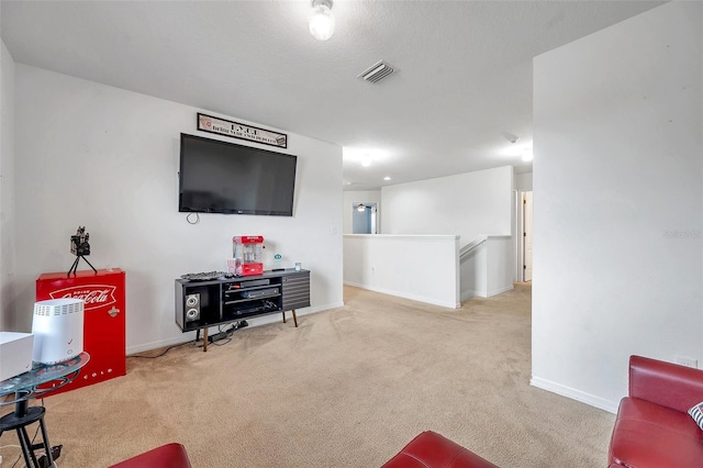 carpeted living room with a textured ceiling