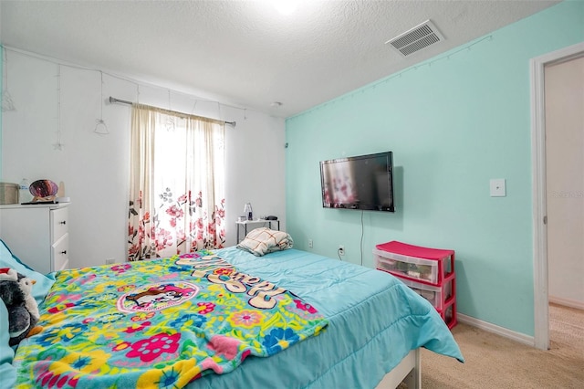 carpeted bedroom featuring a textured ceiling