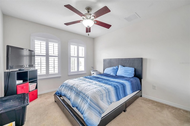 bedroom featuring ceiling fan and light colored carpet