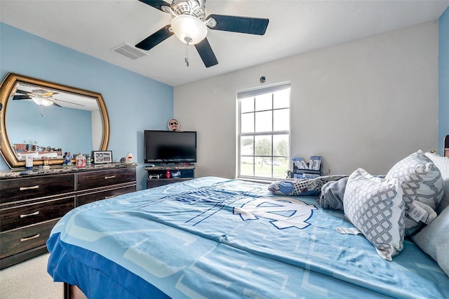 bedroom featuring ceiling fan and carpet