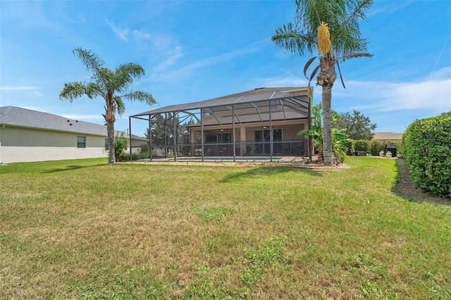 view of yard featuring a lanai and a swimming pool