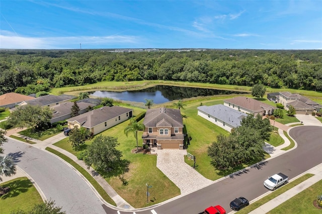 birds eye view of property with a water view