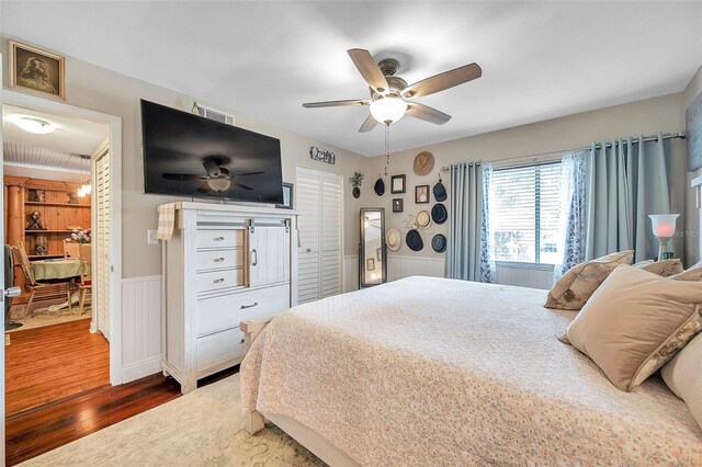 bedroom featuring ceiling fan and dark hardwood / wood-style flooring