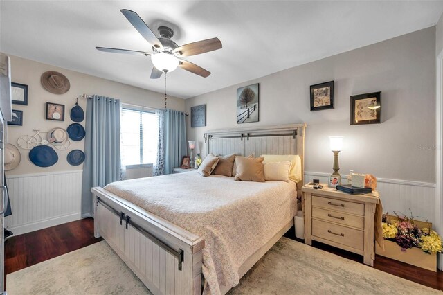 bedroom featuring ceiling fan and dark wood-type flooring