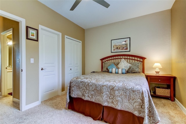 carpeted bedroom featuring ceiling fan and a closet