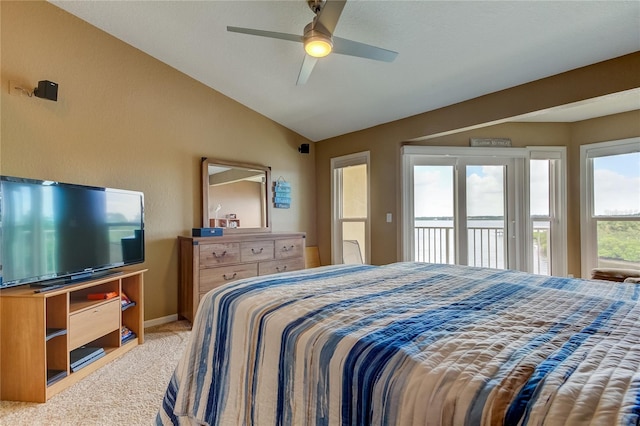 bedroom featuring ceiling fan, vaulted ceiling, access to outside, and light colored carpet