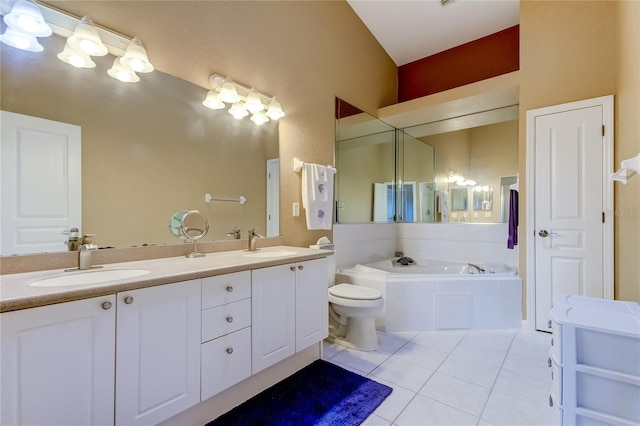 bathroom with tile patterned floors, double sink vanity, toilet, and tiled bath