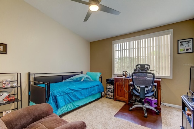 bedroom featuring vaulted ceiling, ceiling fan, and carpet floors