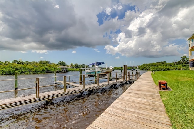 dock area featuring a yard and a water view