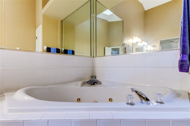 bathroom with tiled tub