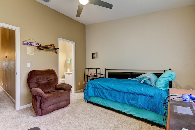 carpeted bedroom featuring ensuite bathroom and ceiling fan