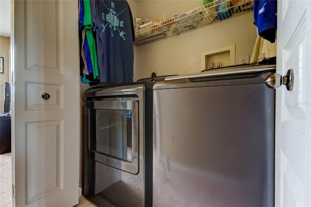 laundry room featuring separate washer and dryer