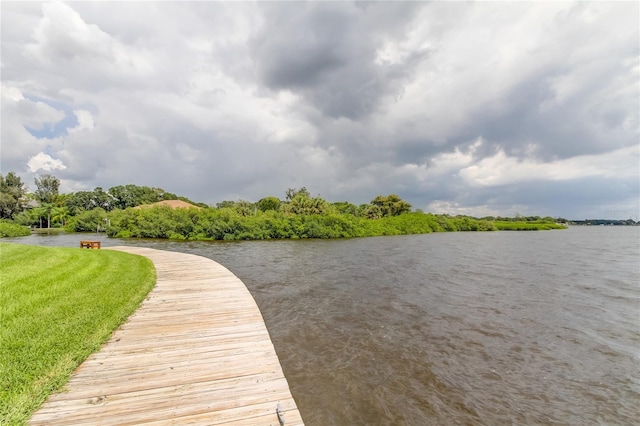 dock area featuring a yard and a water view