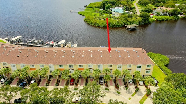 birds eye view of property with a water view