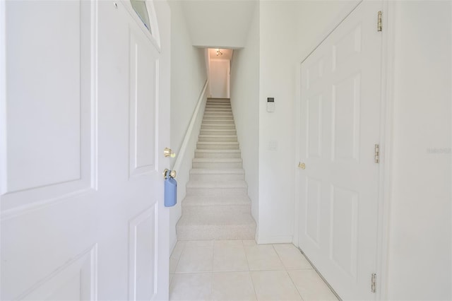 stairs with tile patterned flooring