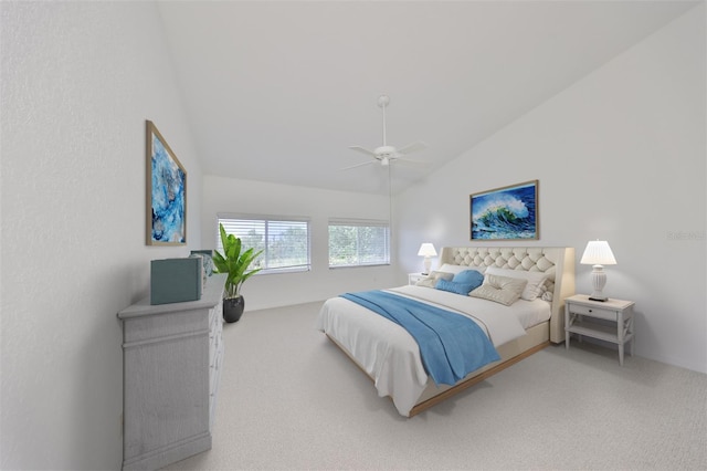 bedroom with vaulted ceiling, ceiling fan, and carpet floors