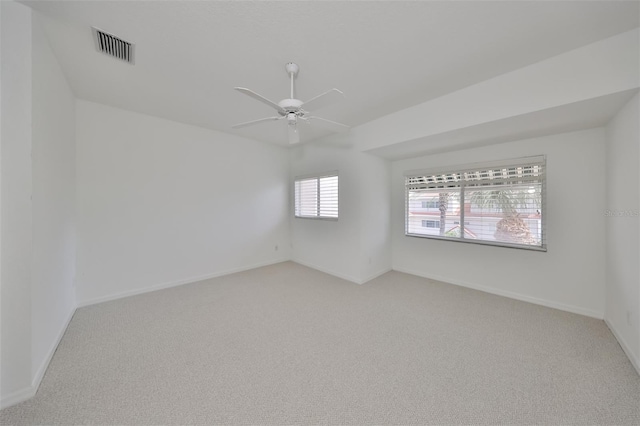 carpeted empty room featuring ceiling fan