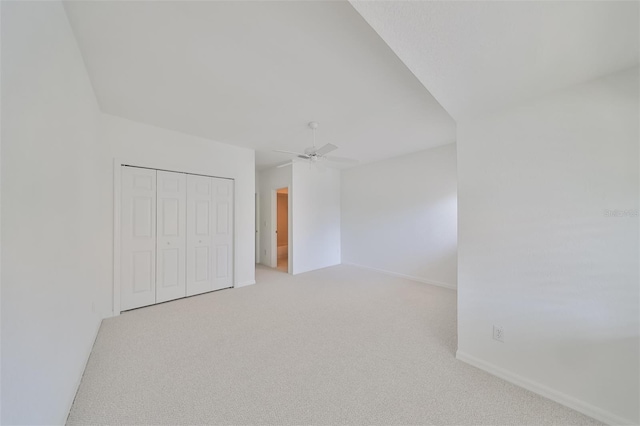 carpeted empty room with ceiling fan