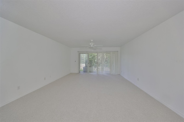 unfurnished room featuring ceiling fan and carpet flooring