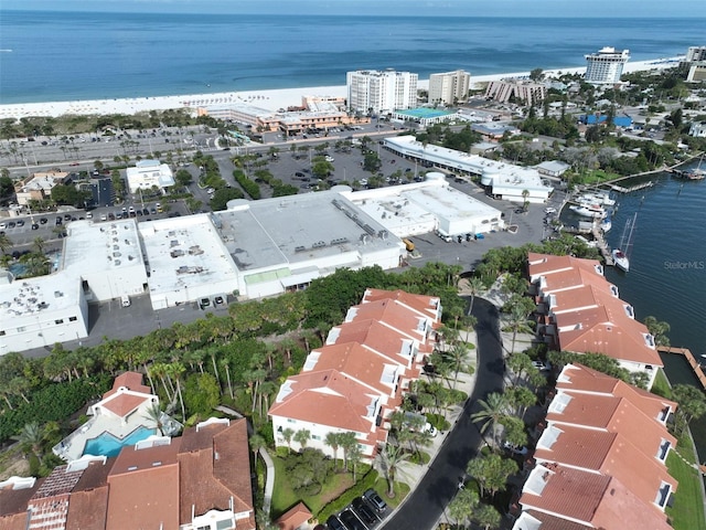 bird's eye view featuring a view of the beach and a water view