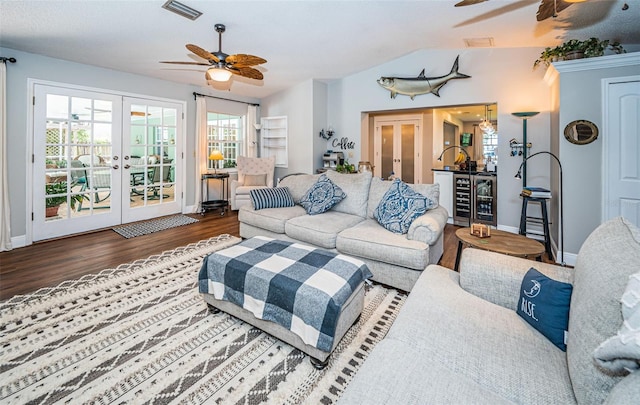 living room with hardwood / wood-style flooring, ceiling fan, and french doors