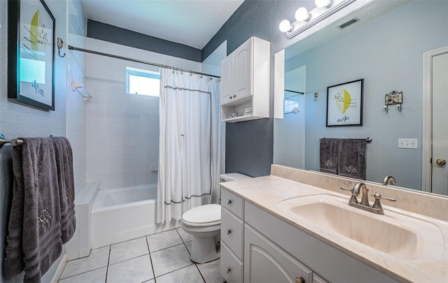 full bathroom with tile patterned flooring, toilet, shower / tub combo, and vanity