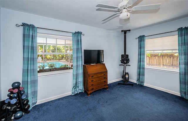 bedroom featuring dark colored carpet and ceiling fan