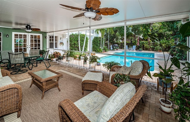 view of pool featuring an outdoor hangout area, a patio area, and ceiling fan