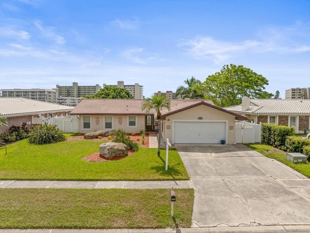 single story home featuring a garage and a front lawn