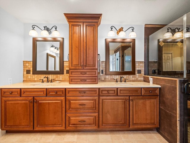 bathroom featuring vanity and backsplash