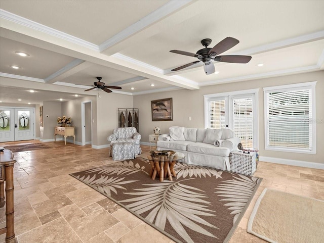 living room featuring ceiling fan, ornamental molding, beamed ceiling, and coffered ceiling