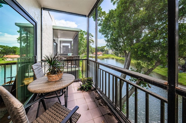 balcony featuring a water view