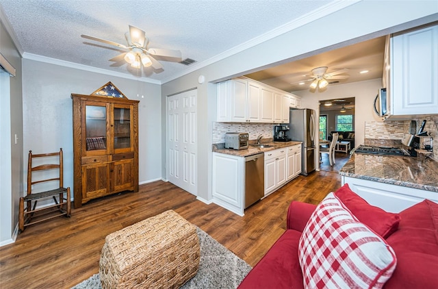 kitchen featuring white cabinetry, dark hardwood / wood-style floors, and backsplash