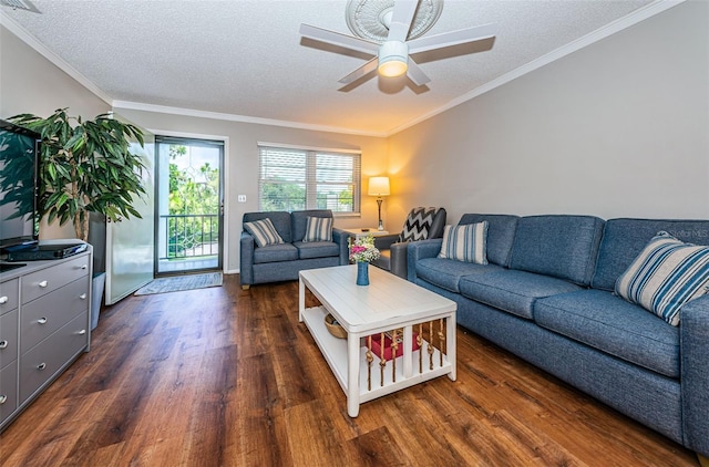 living room featuring a textured ceiling, ceiling fan, ornamental molding, and dark hardwood / wood-style floors