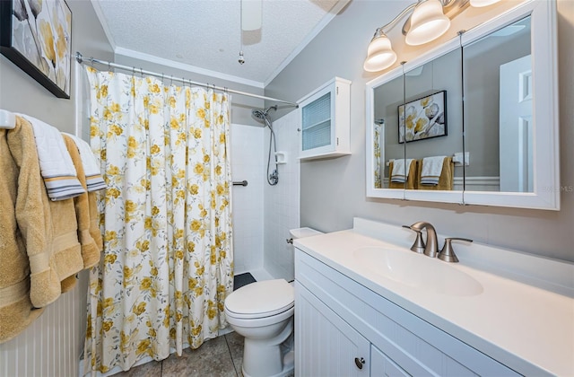 bathroom featuring a textured ceiling, tile patterned flooring, vanity, crown molding, and toilet