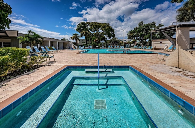 view of swimming pool featuring a patio