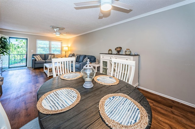 dining area featuring ceiling fan, ornamental molding, a textured ceiling, and dark hardwood / wood-style flooring