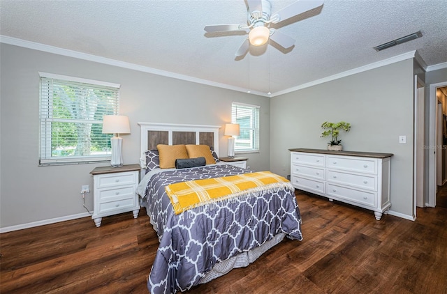 bedroom featuring ceiling fan, dark hardwood / wood-style floors, ornamental molding, and multiple windows