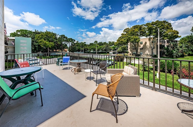 view of patio featuring a balcony